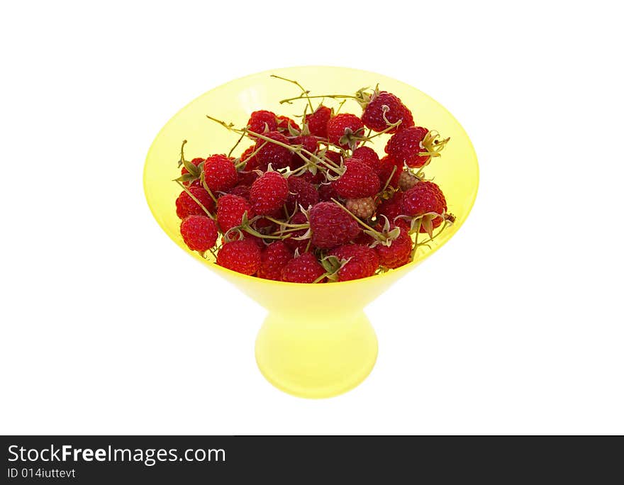 Ripe raspberry in yellow bowl isolated on white background