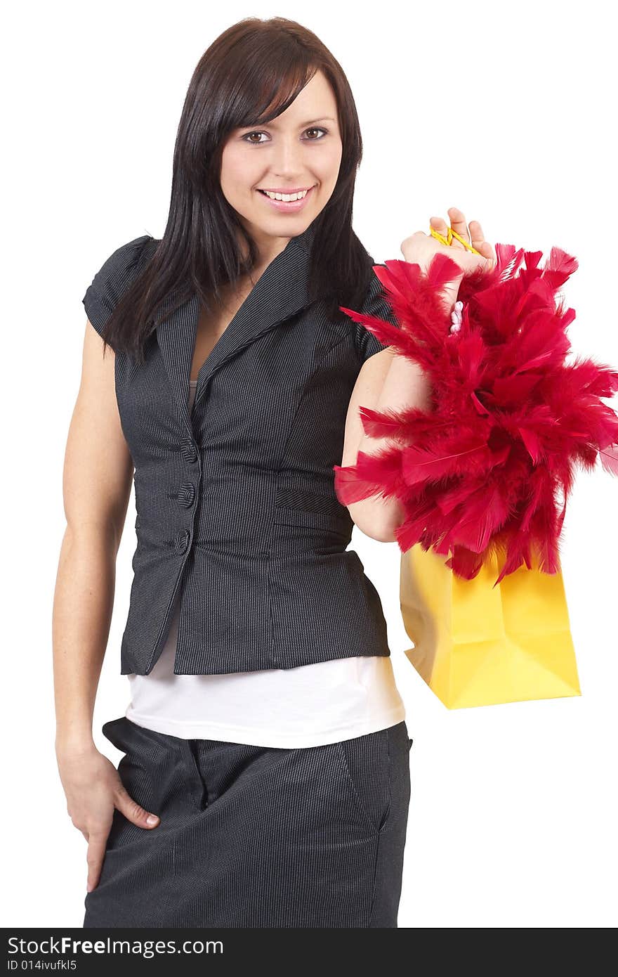 Portrait of a beautiful young brunette woman holding a shopping bag with red fur in it. Isolated on white background. Portrait of a beautiful young brunette woman holding a shopping bag with red fur in it. Isolated on white background