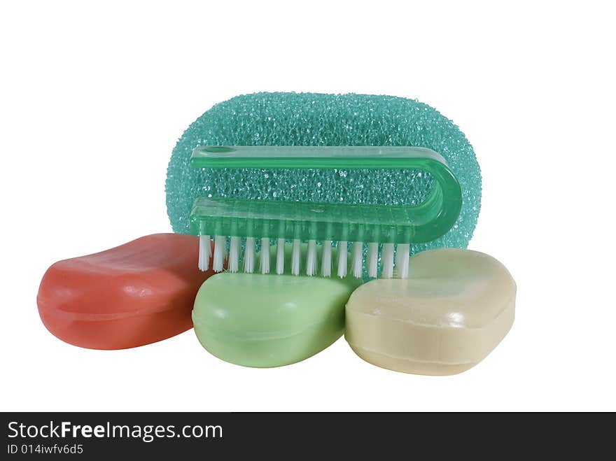 Brush lying on soap and sponge isolated on white background. Brush lying on soap and sponge isolated on white background