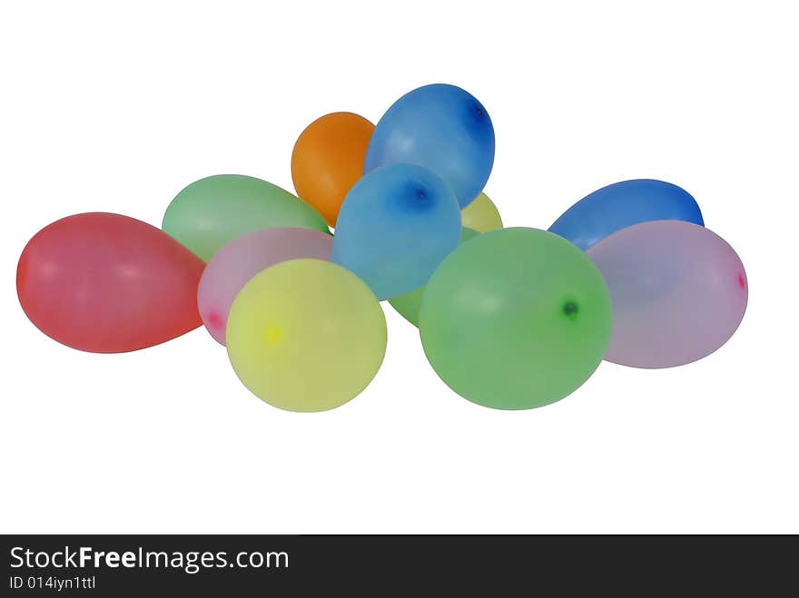 Spilled small colorful balloons isolated on white background