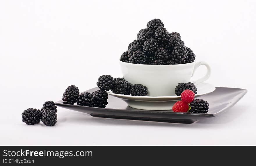 Macro view of fresh ripe blackberries in the bowl. Macro view of fresh ripe blackberries in the bowl