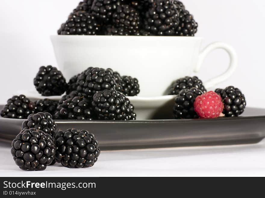 Macro view of fresh ripe blackberries in the bowl. Macro view of fresh ripe blackberries in the bowl