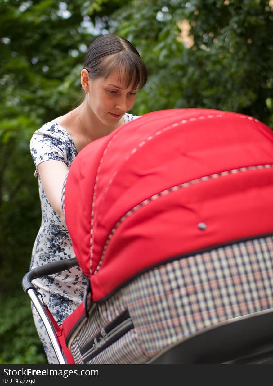 Woman with baby carriage