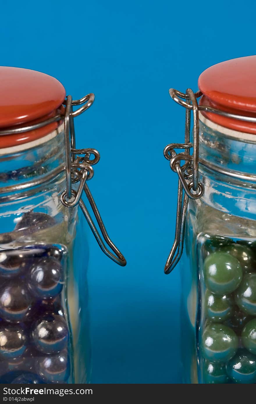 Two Glass Jars With Red Lids