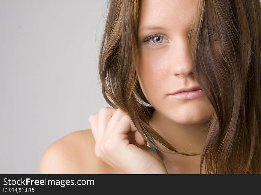 Portrait of young beautiful woman on white background