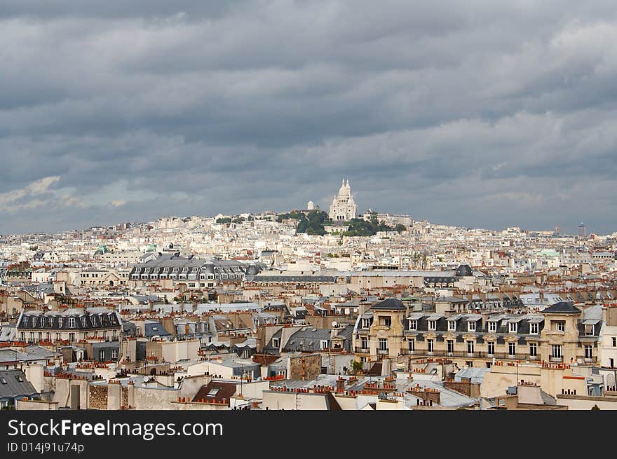 Roofs of Paris with Basilique du Sacre Coeur in background