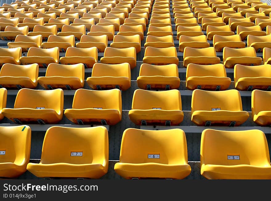 The stand with yellow seats. The stand with yellow seats