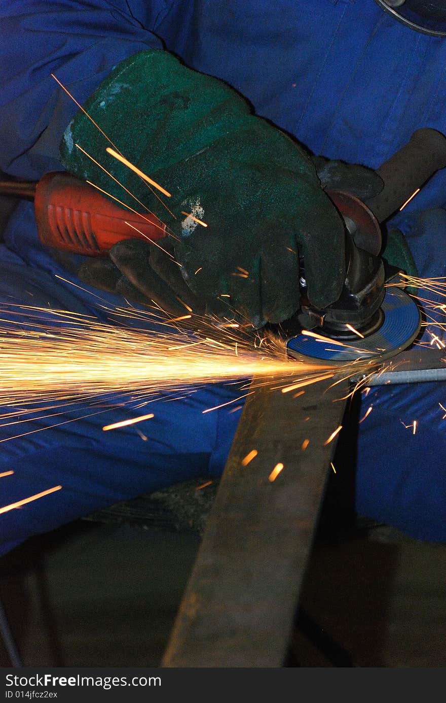 A metal welder busy at work. A metal welder busy at work