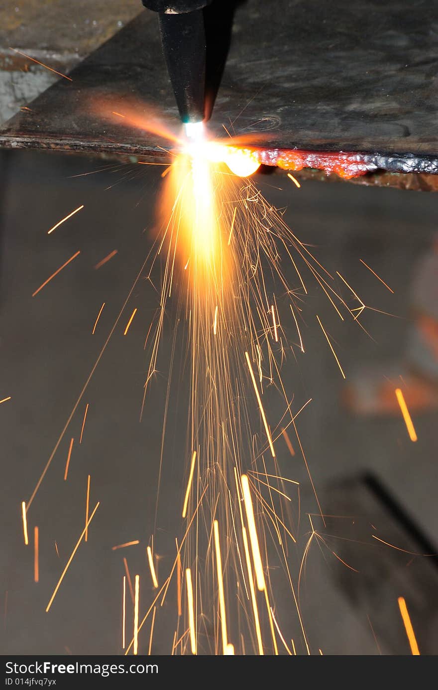 A metal welder busy at work. A metal welder busy at work