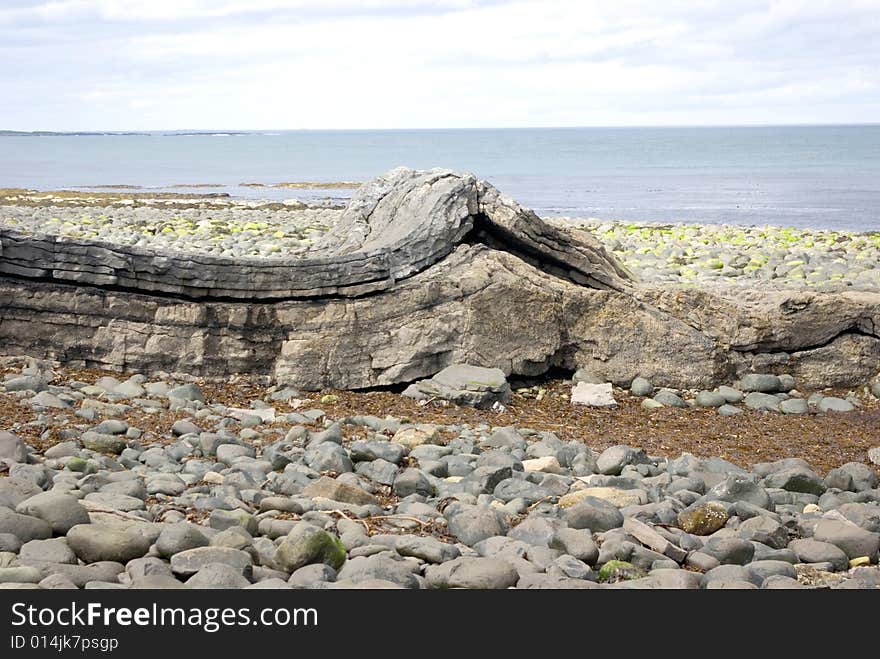 Two rocks pushing together have caused the rock to push up. Two rocks pushing together have caused the rock to push up.