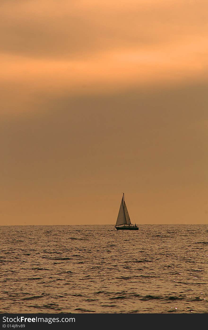 A sailboat at sea in the Pacific Ocean. Nearest port is Los Cabos, Mexico. A sailboat at sea in the Pacific Ocean. Nearest port is Los Cabos, Mexico.