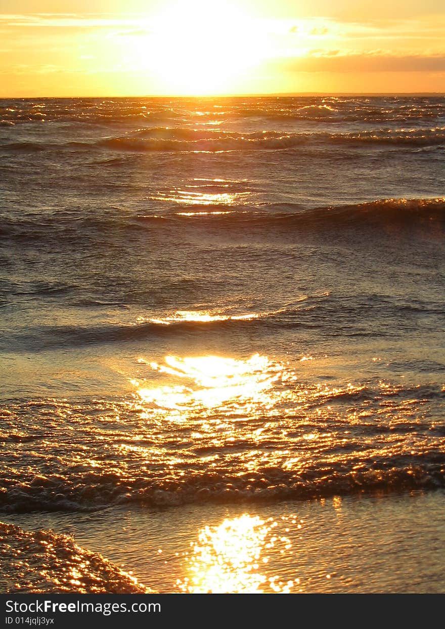 Sunrays on the waves of water. Sunrays on the waves of water.