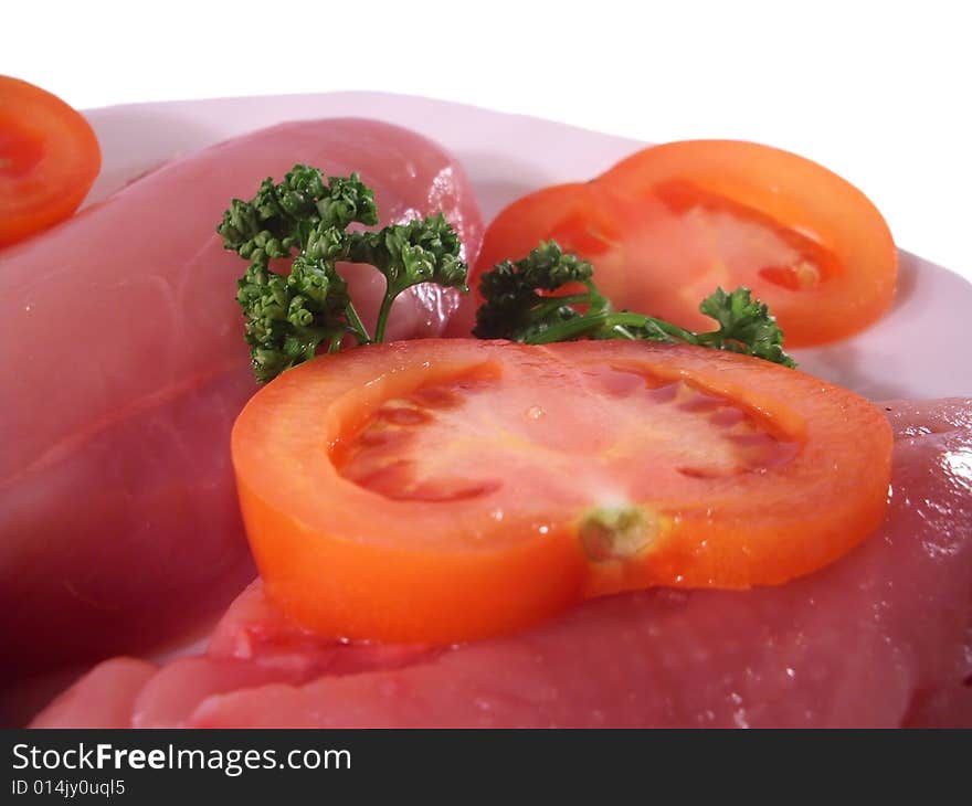 Slices of tomato and fresh meat