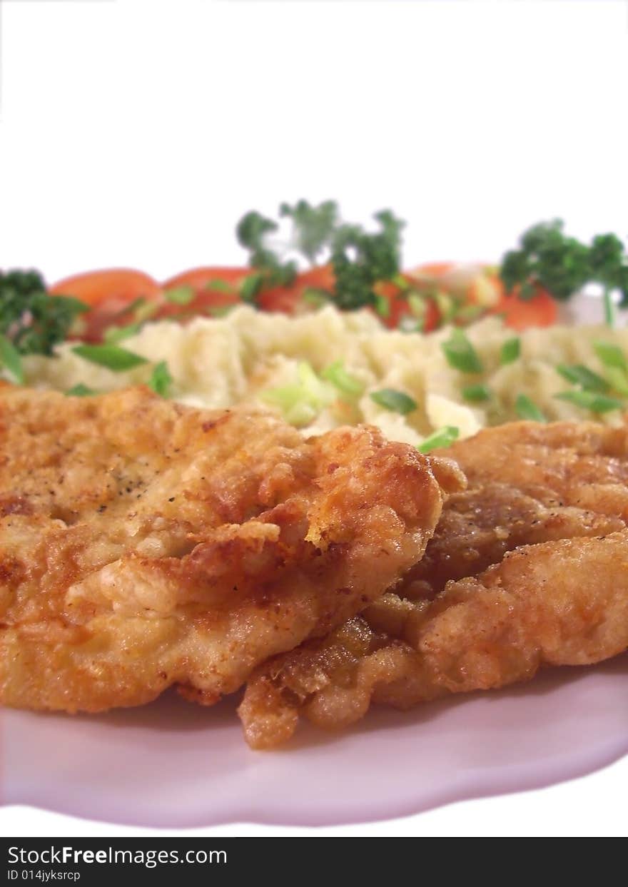 Isolated plate with meat and vegetables