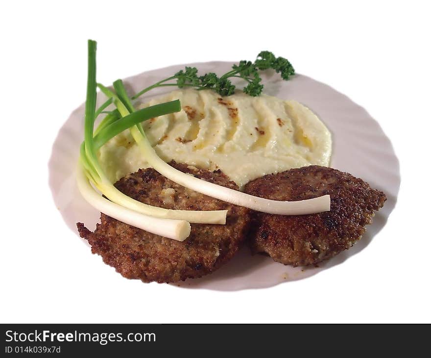 Green onion and meat on a plate