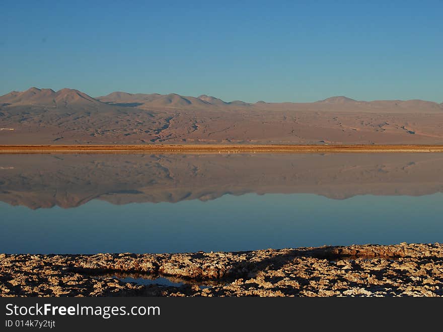 The reflection of the mountain range in the crystal water