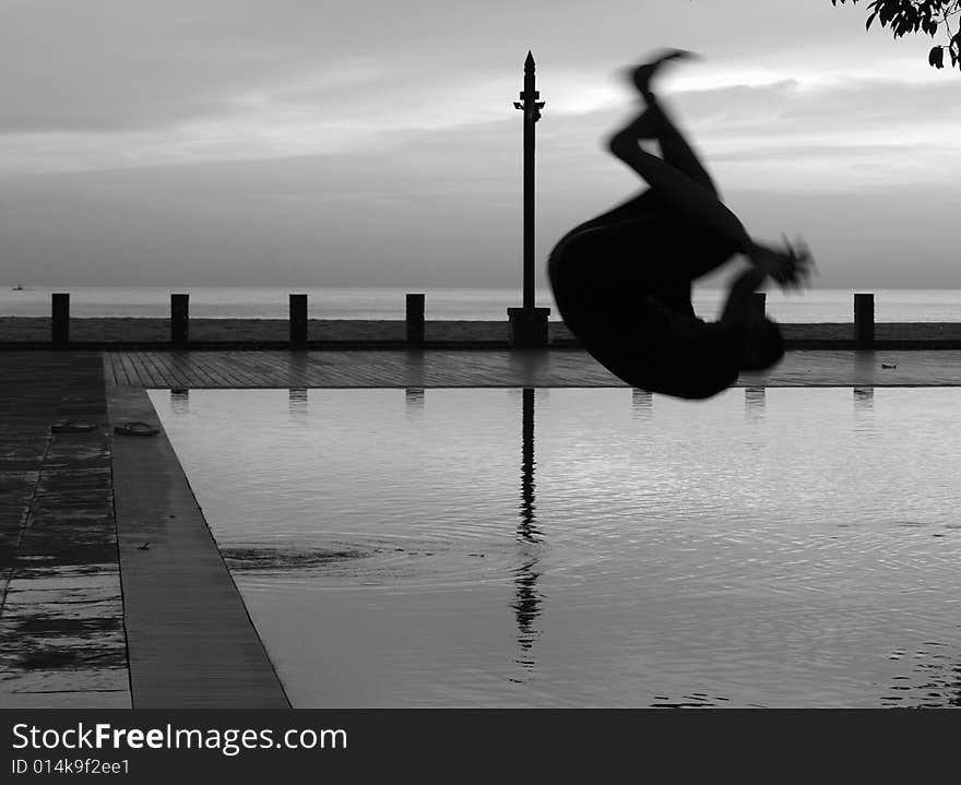 Man Silhouette Somersault Pool One