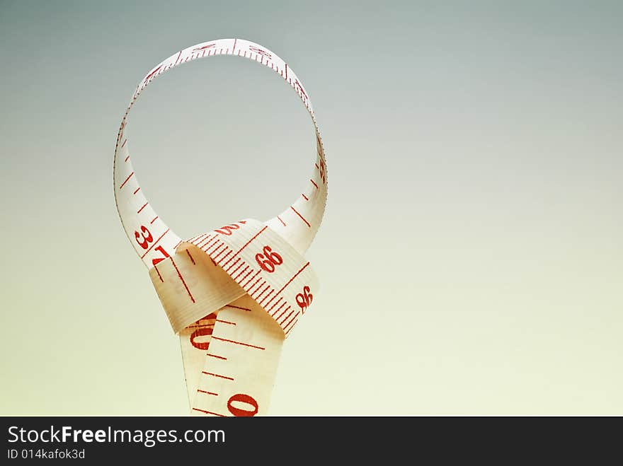 Studio shot of measuring tape against white background. Studio shot of measuring tape against white background