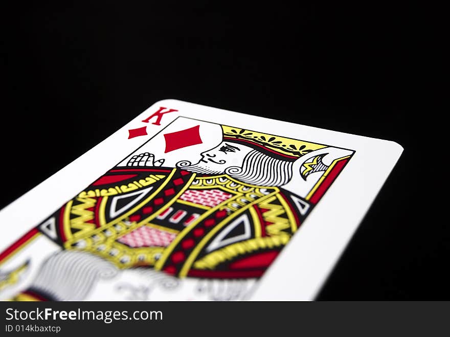 King of Diamonds against black background. King of Diamonds against black background