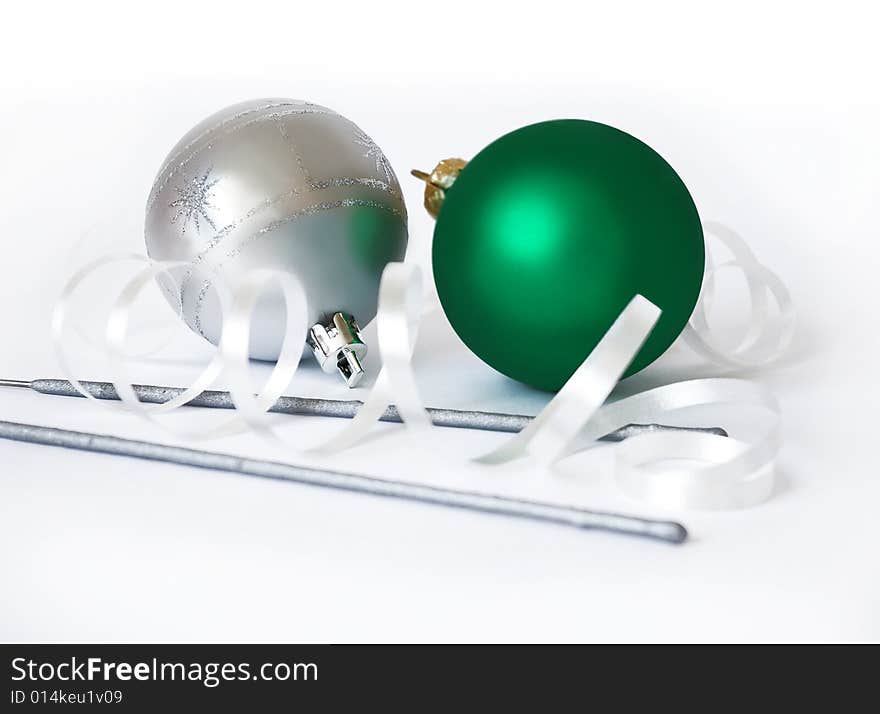 Christmas spheres and sparks on a white background