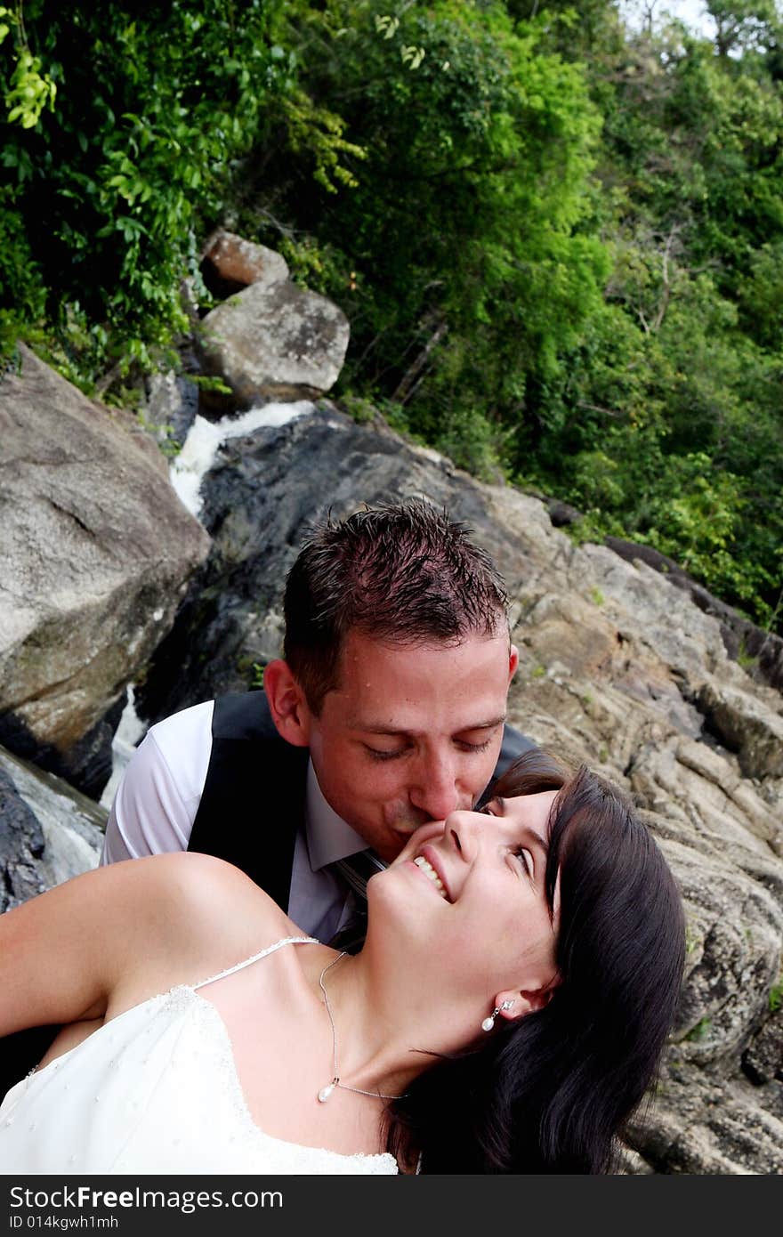 Happy bride and groom kissing on their wedding day.