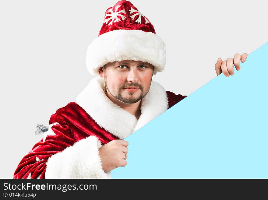 Male caucasian model of santa claus holding a blue board