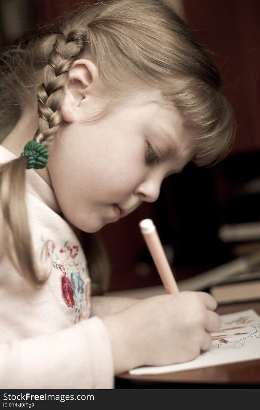 An image of little girl with pencil. An image of little girl with pencil