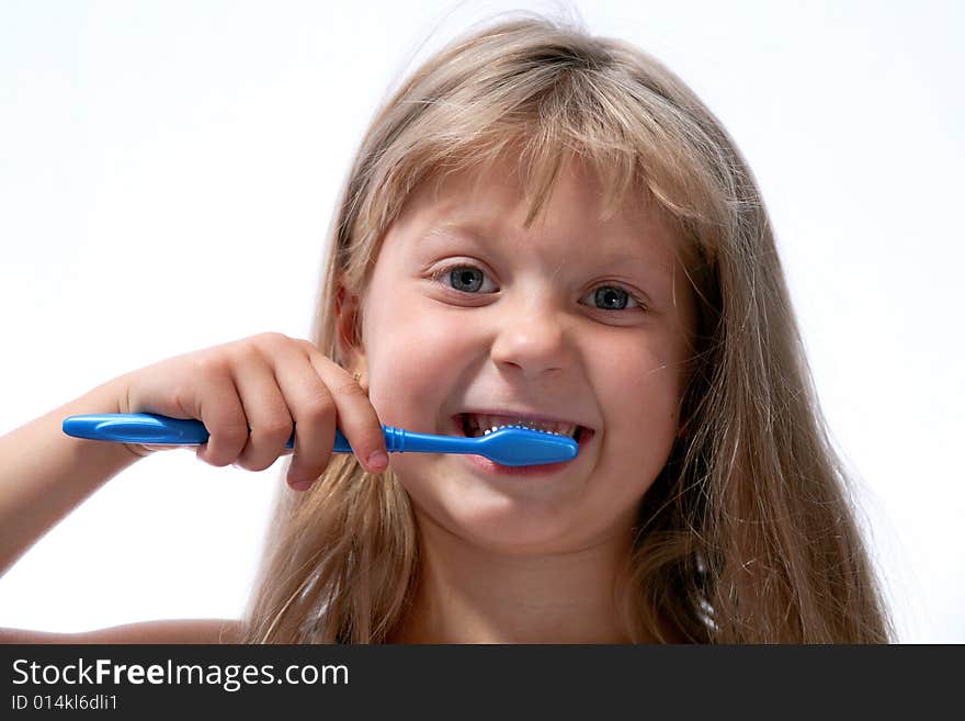 Little girl with toothbrush on neutral background. Little girl with toothbrush on neutral background