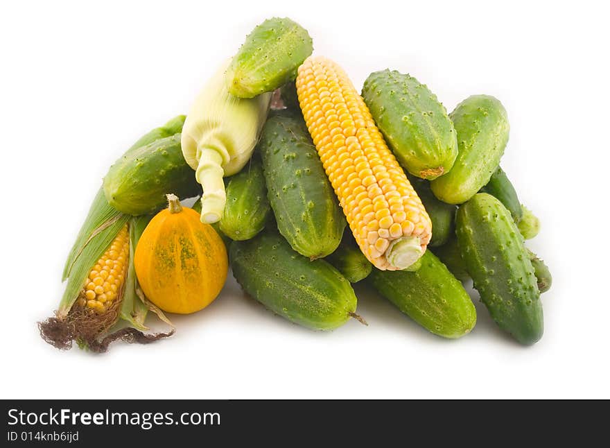 Cucumbers with corn and a pumpkin