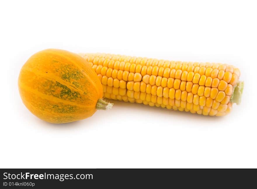 Yellow corn with a yellow pumpkin on a white background