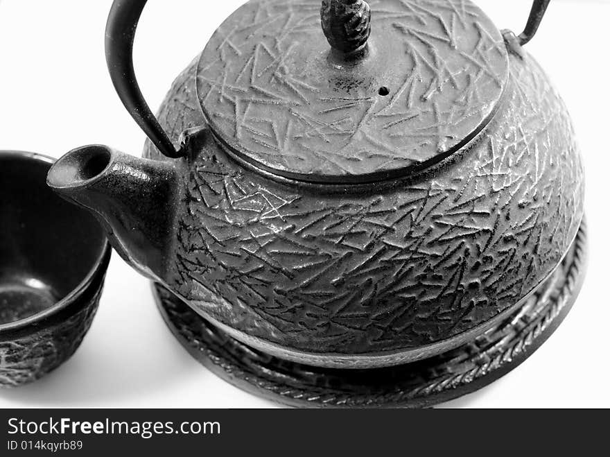 This is a shot of a Chinese tea pot and cup.