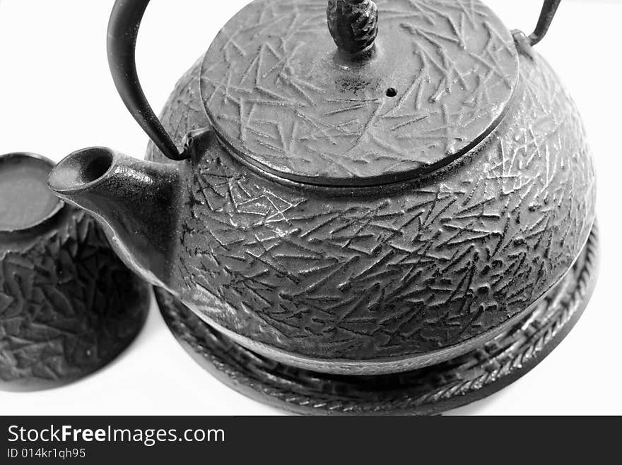 This is a shot of a Chinese tea pot and cup.