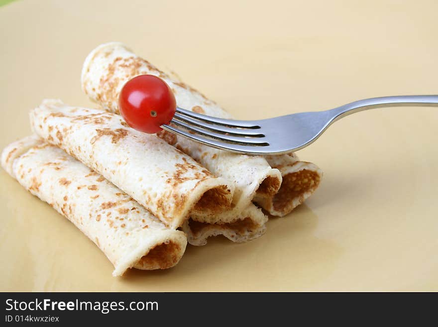 Close up of pancakes on a yellow plate. Close up of pancakes on a yellow plate