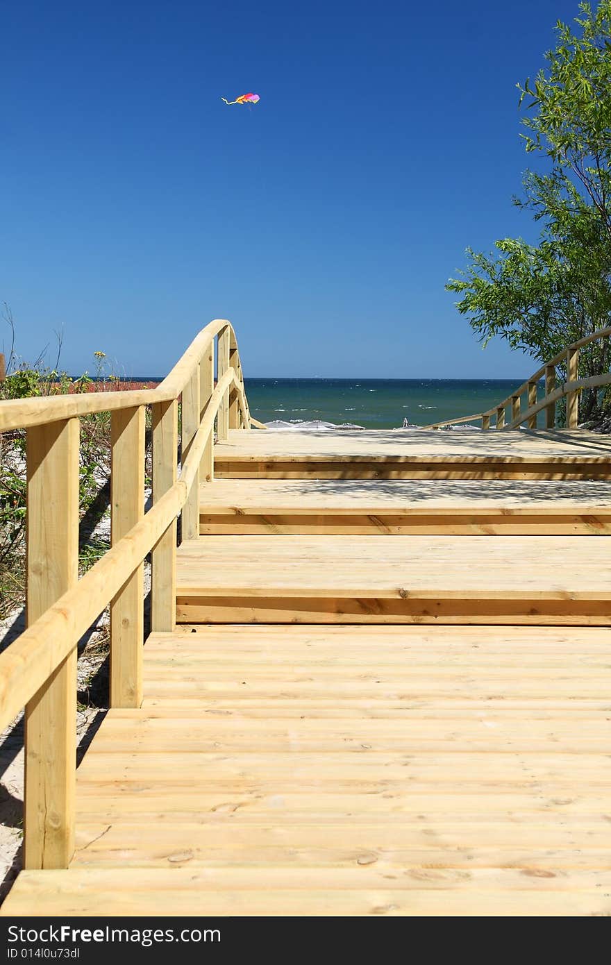 Wooden pier and small kite