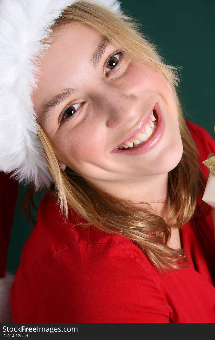 Christmas teen wearing a red hat with a big smile