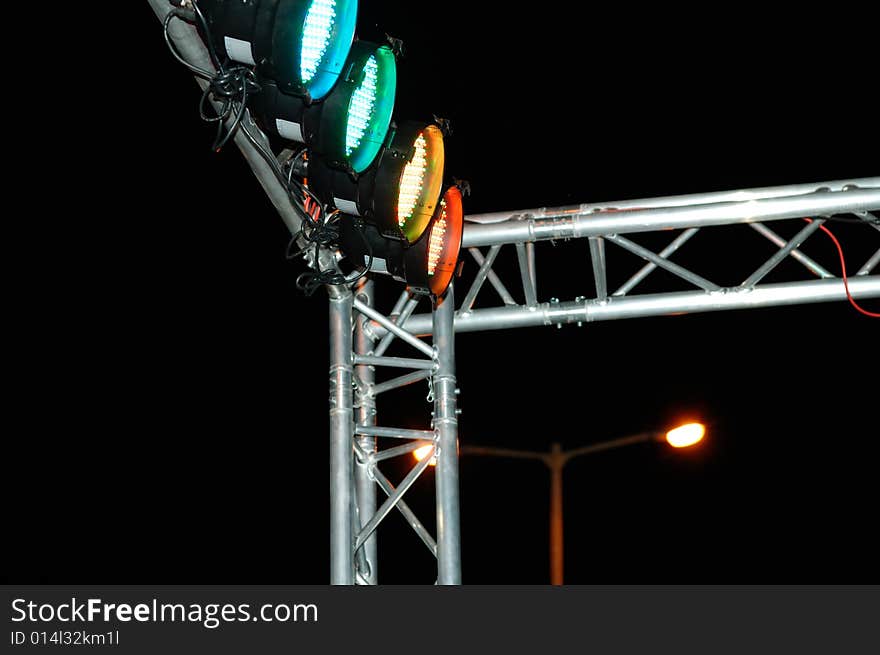 Footlights against the black background