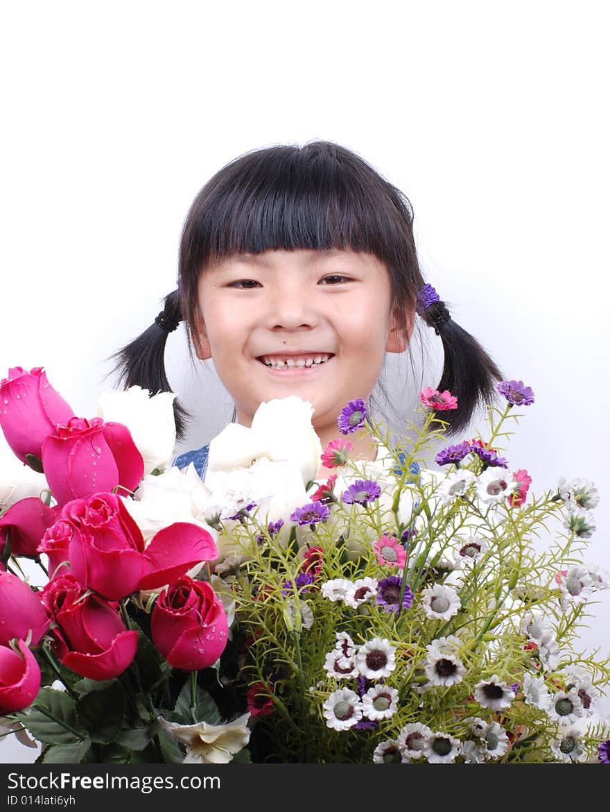 Asia girl smiling behind flowers. Asia girl smiling behind flowers