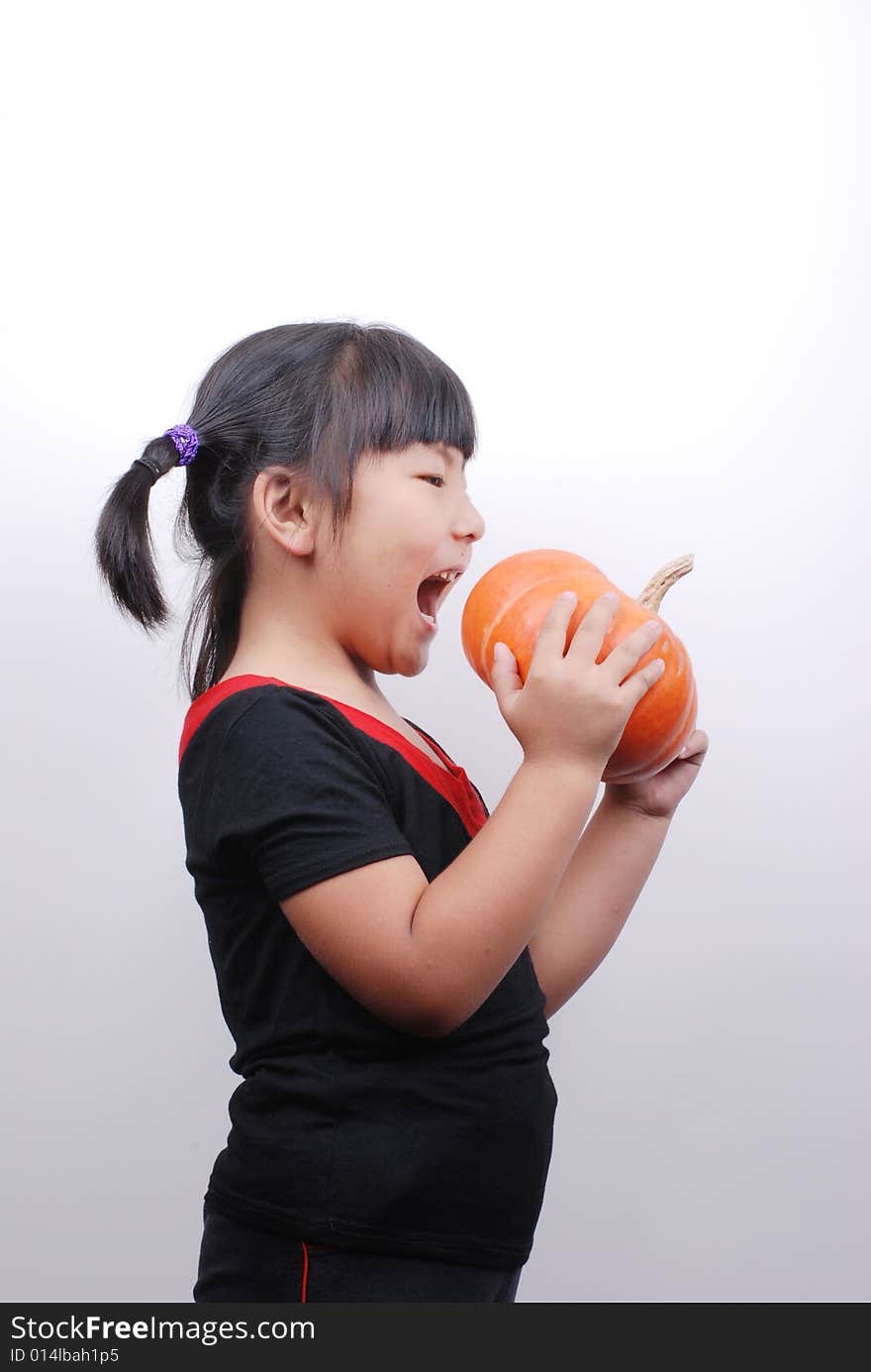 Asia girl eating pumpkin on white background. Asia girl eating pumpkin on white background