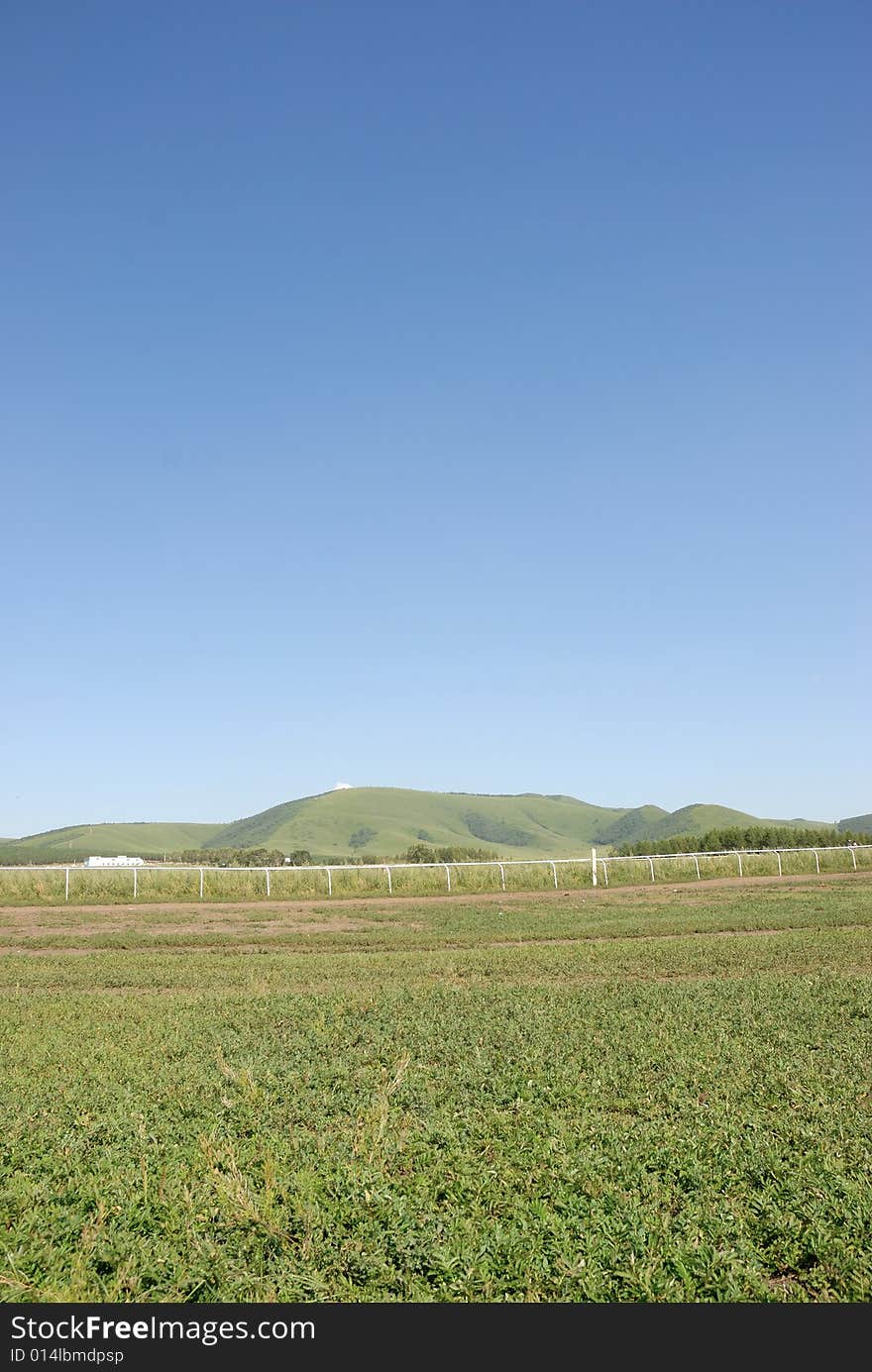 Glass land with blue sky and hill