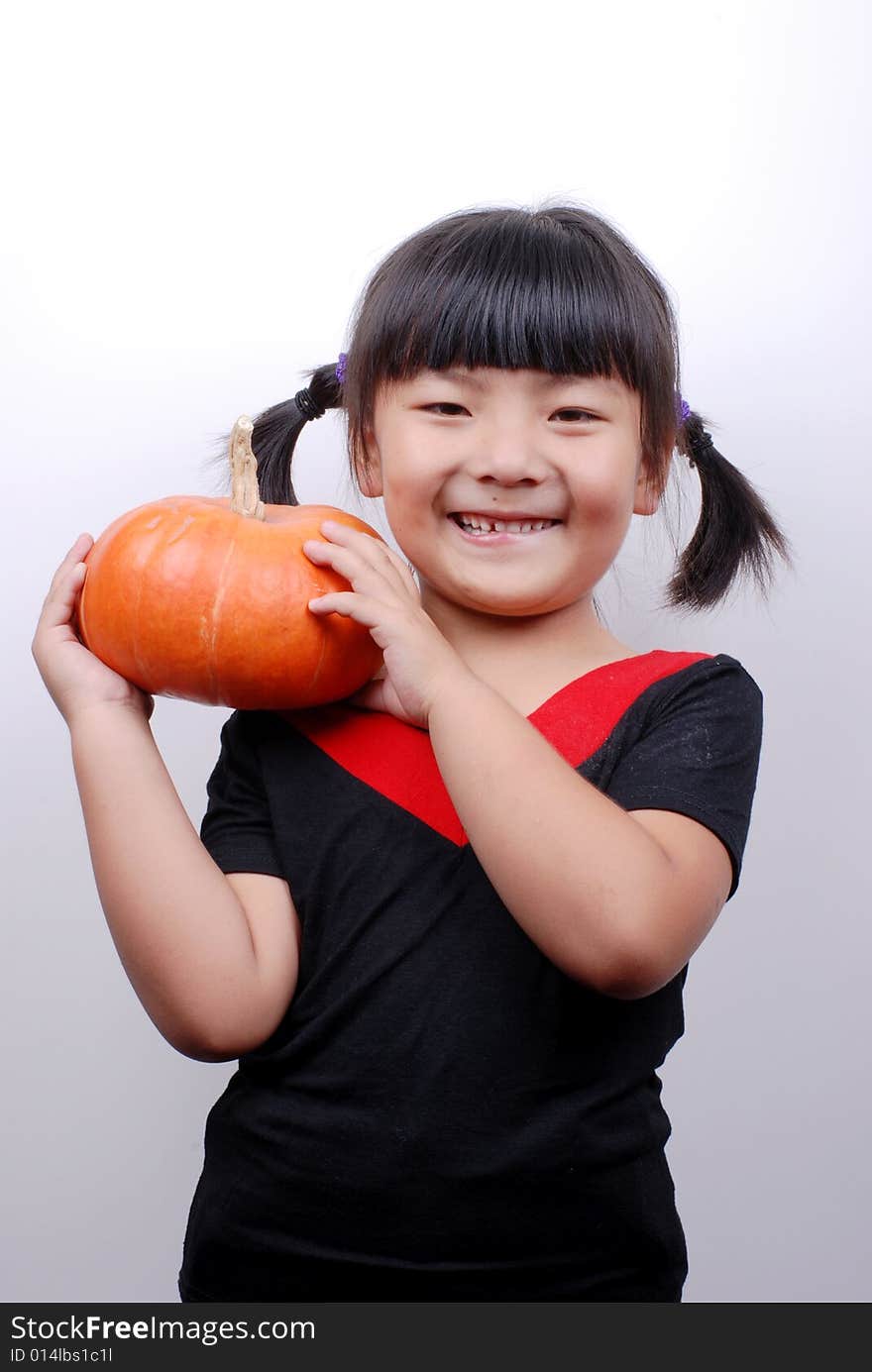 Asia girl shy and smiling with pumpkin on white background. Asia girl shy and smiling with pumpkin on white background