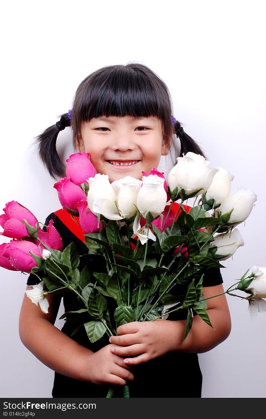 Asia girl smiling behind flowers. Asia girl smiling behind flowers