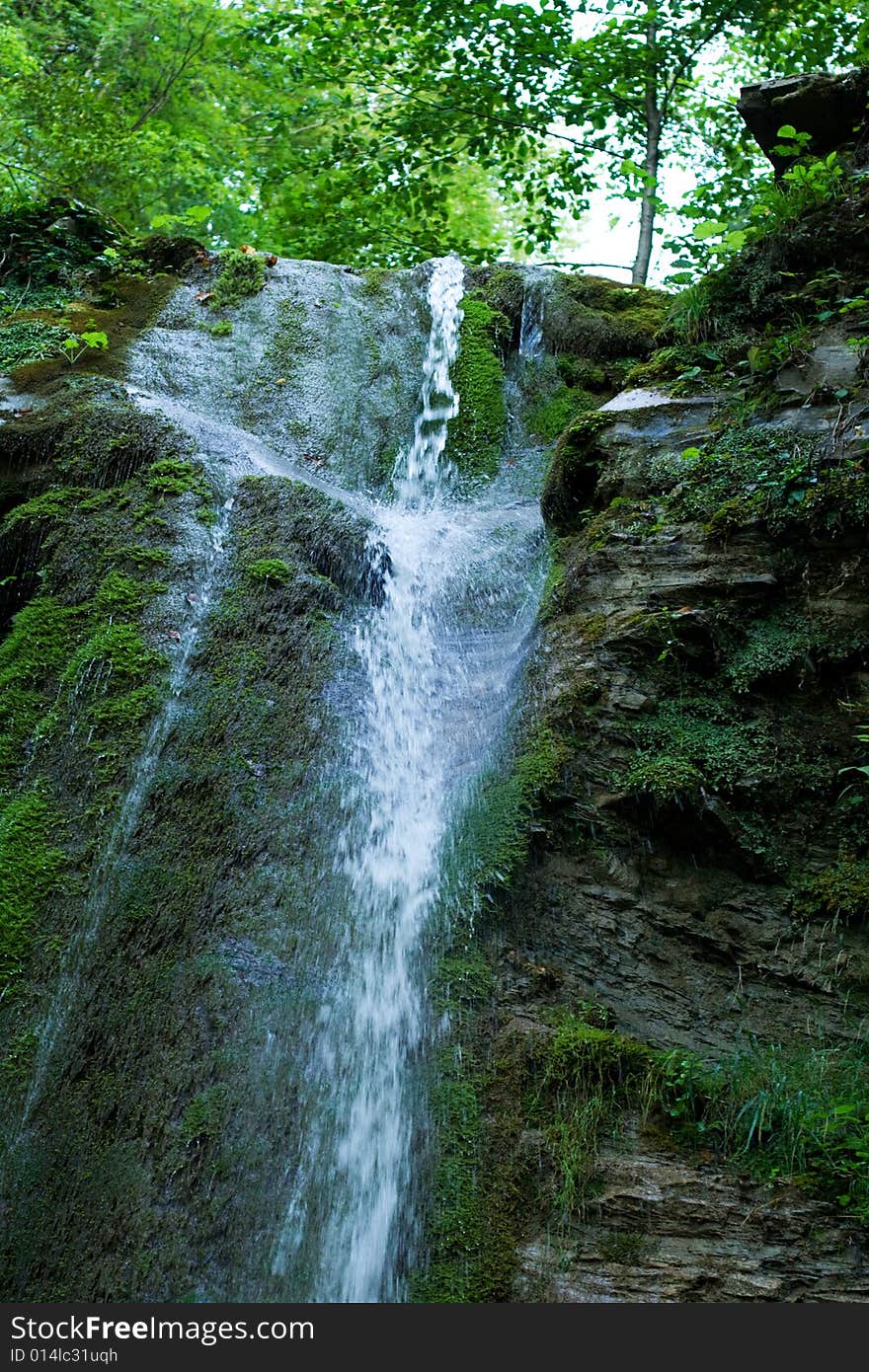 Waterfall in the forest, caucasus mountains