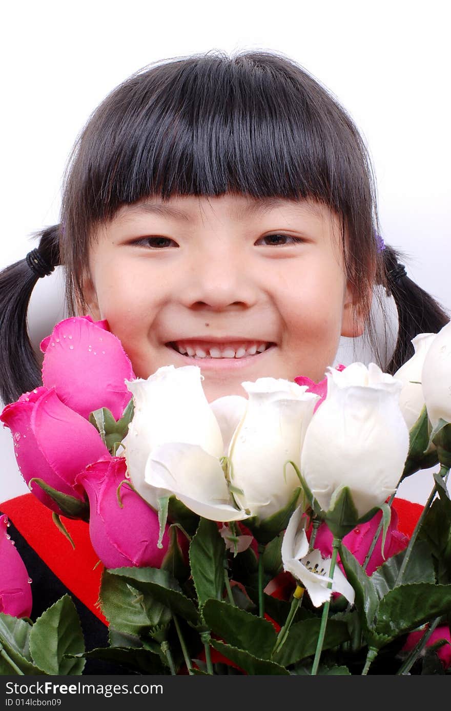 Asia girl smiling behind flowers. Asia girl smiling behind flowers