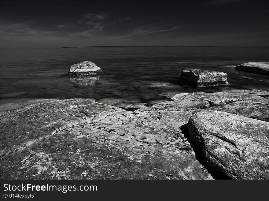 A black and white photo of limestone sheashore. A black and white photo of limestone sheashore.