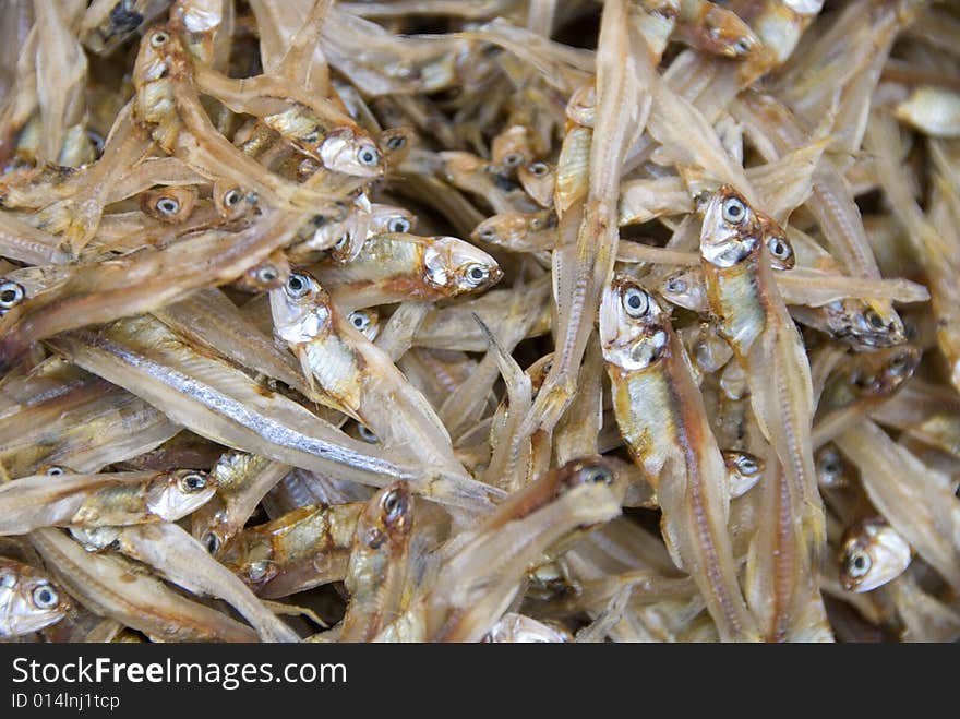 Chinese market display of very tiny dried fish.