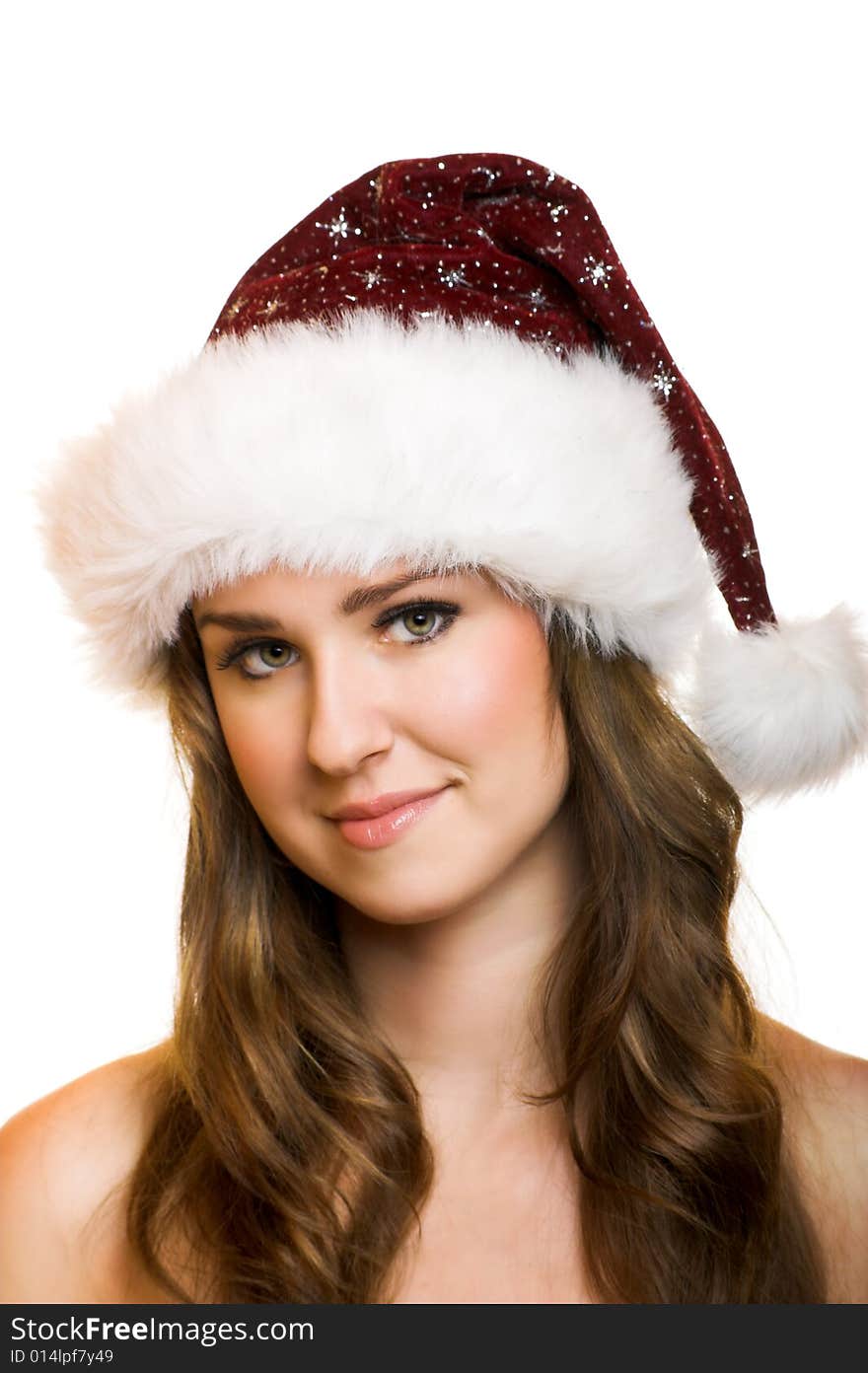 Isolated portrait of a beautiful young smiling woman with a christmas cap. Isolated portrait of a beautiful young smiling woman with a christmas cap