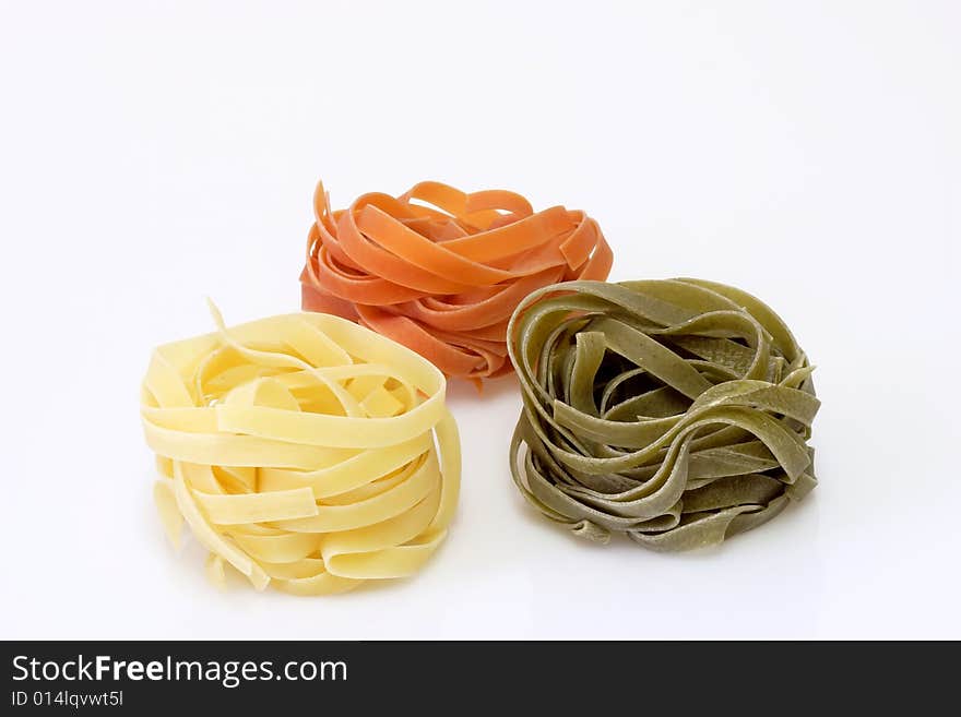 Raw pasta on bright background. Shot in Studio. Raw pasta on bright background. Shot in Studio.