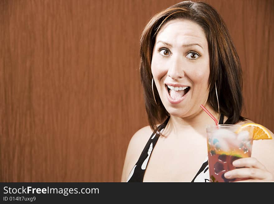 Hispanic woman having fun and holding a drink. Hispanic woman having fun and holding a drink