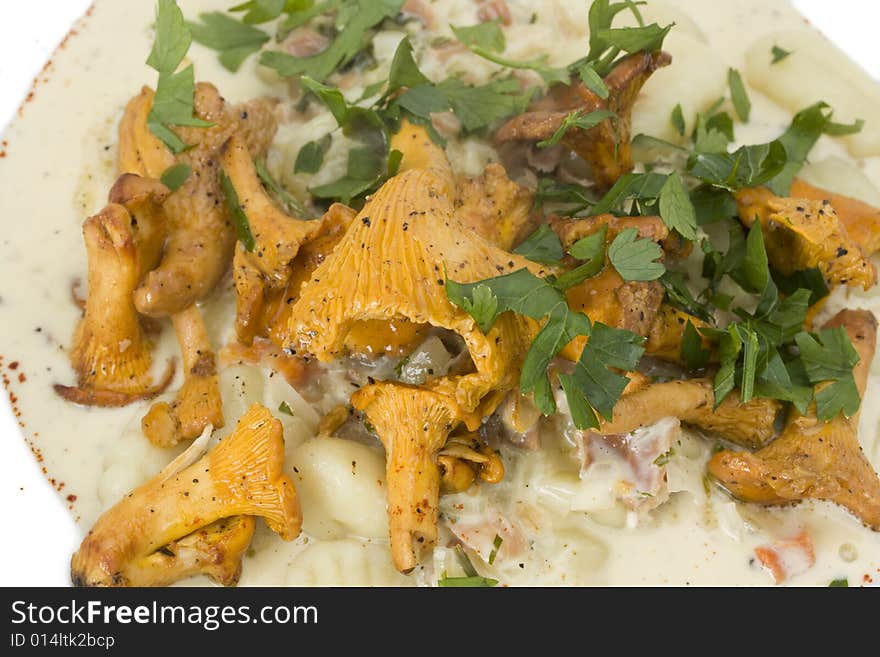 Chanterelles and gnocchi pasta on a plate