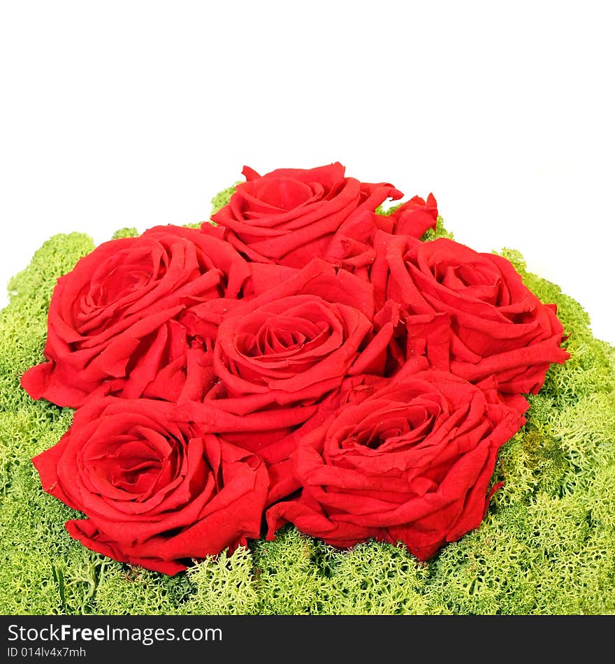 Bunch of red roses with green decor isolated